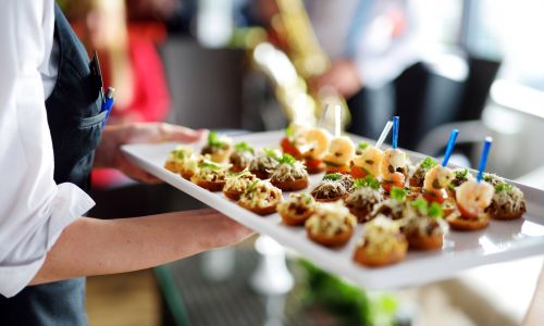Waiter carrying platter