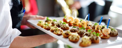 Waiter carrying platter