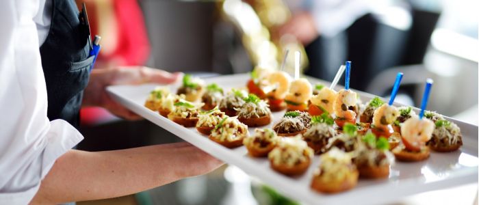 Waiter carrying platter